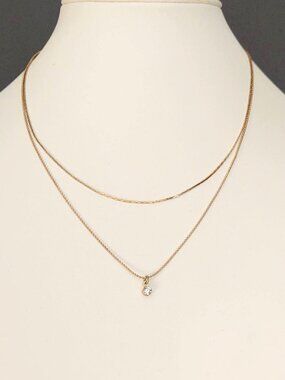 Two strand gold necklace with faux diamond